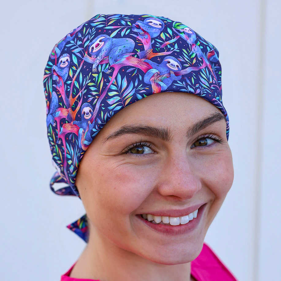 Tieback scrub cap with sloths in pink and purple