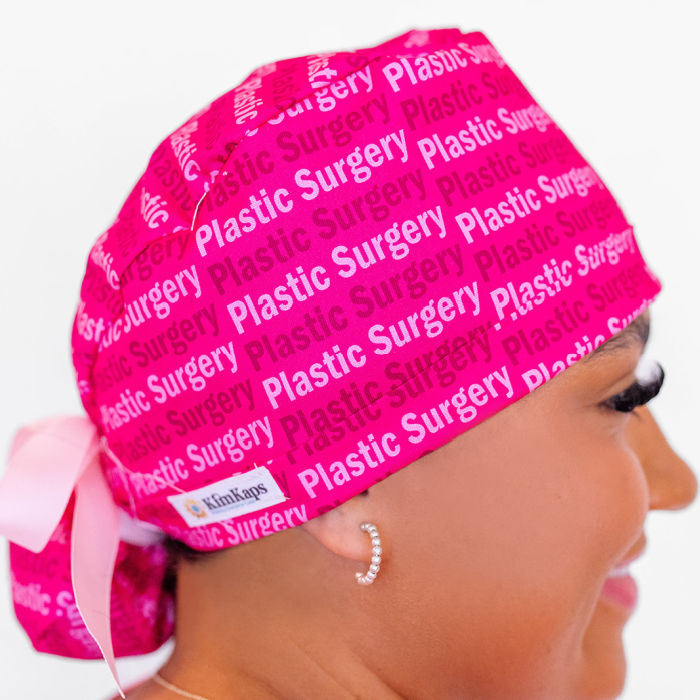 surgical scrub cap with the words Plastic Surgery in a ponytail style