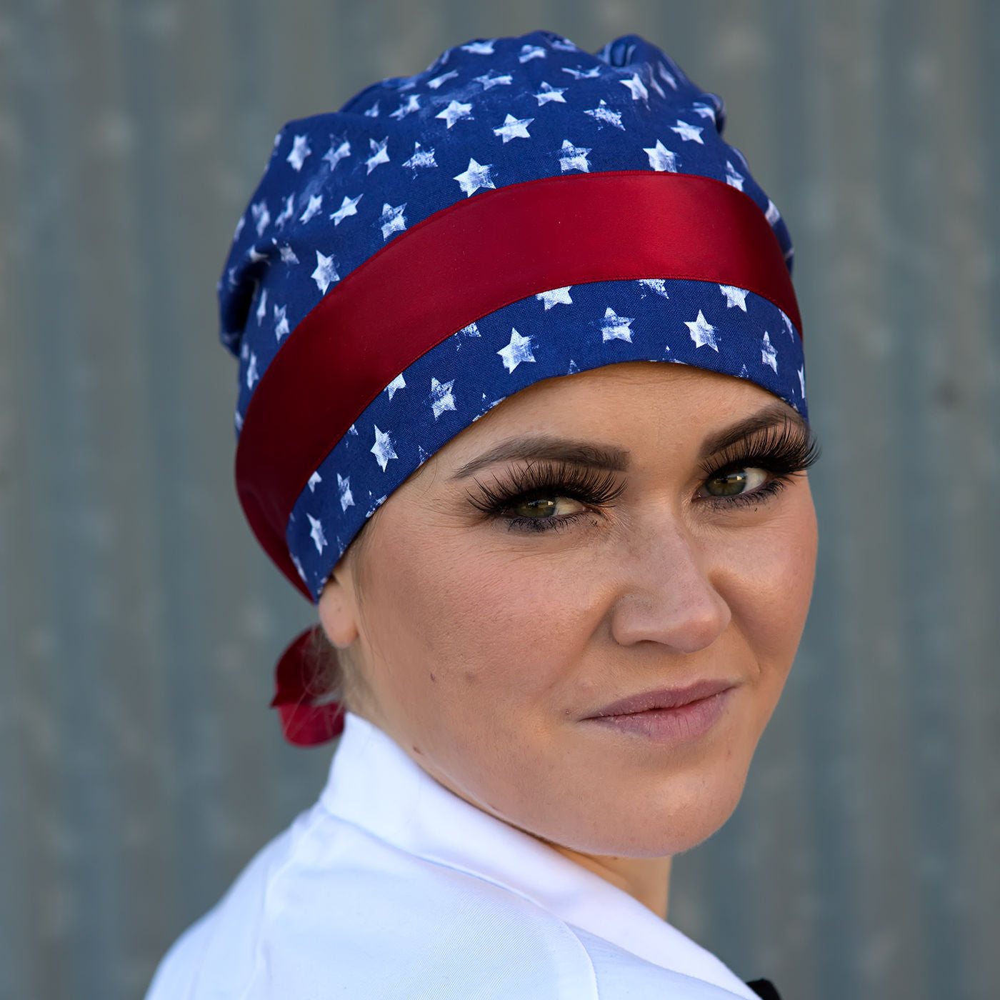 scrub cap with white stars on blue field and red ribbon