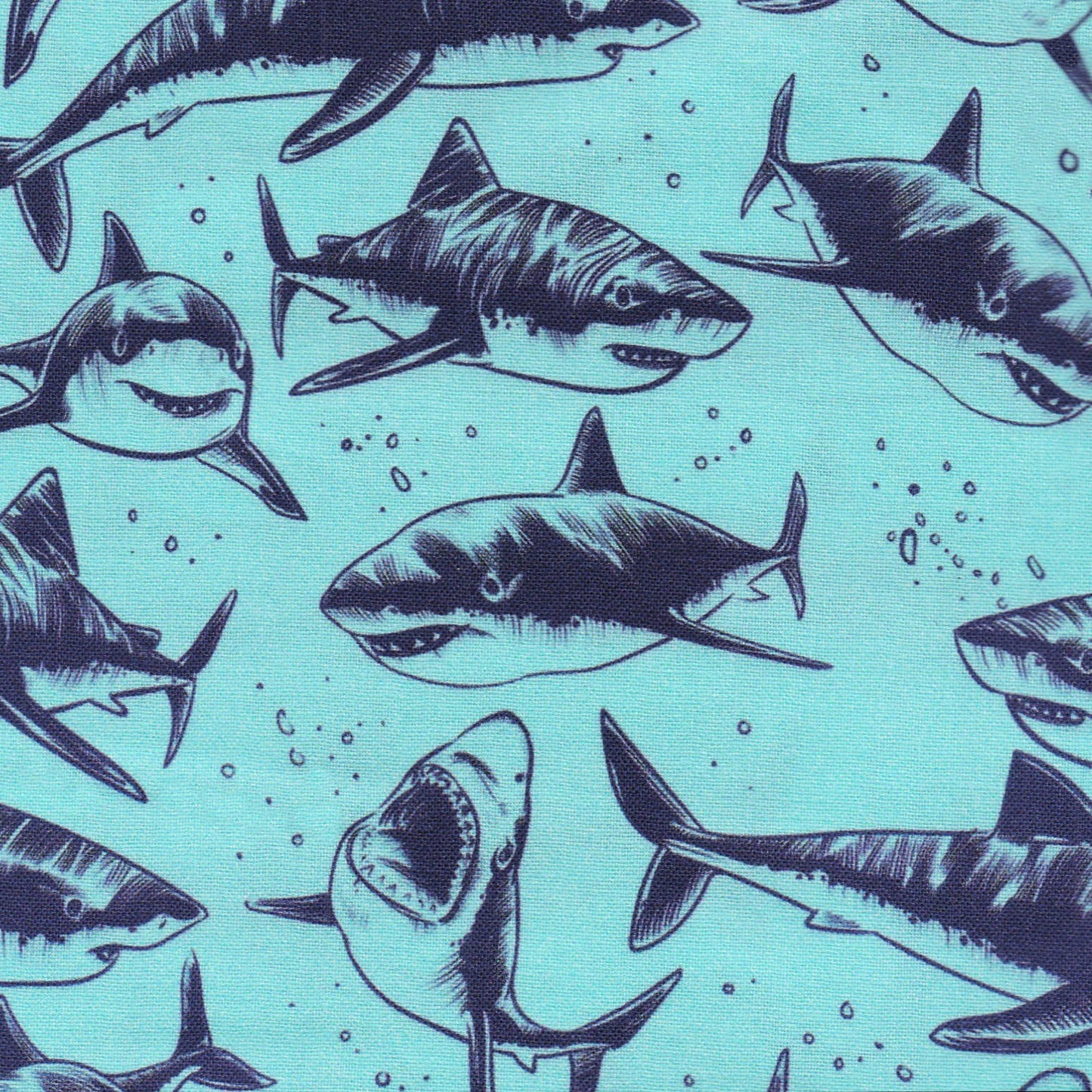 scrub cap with sharks in navy on aqua background