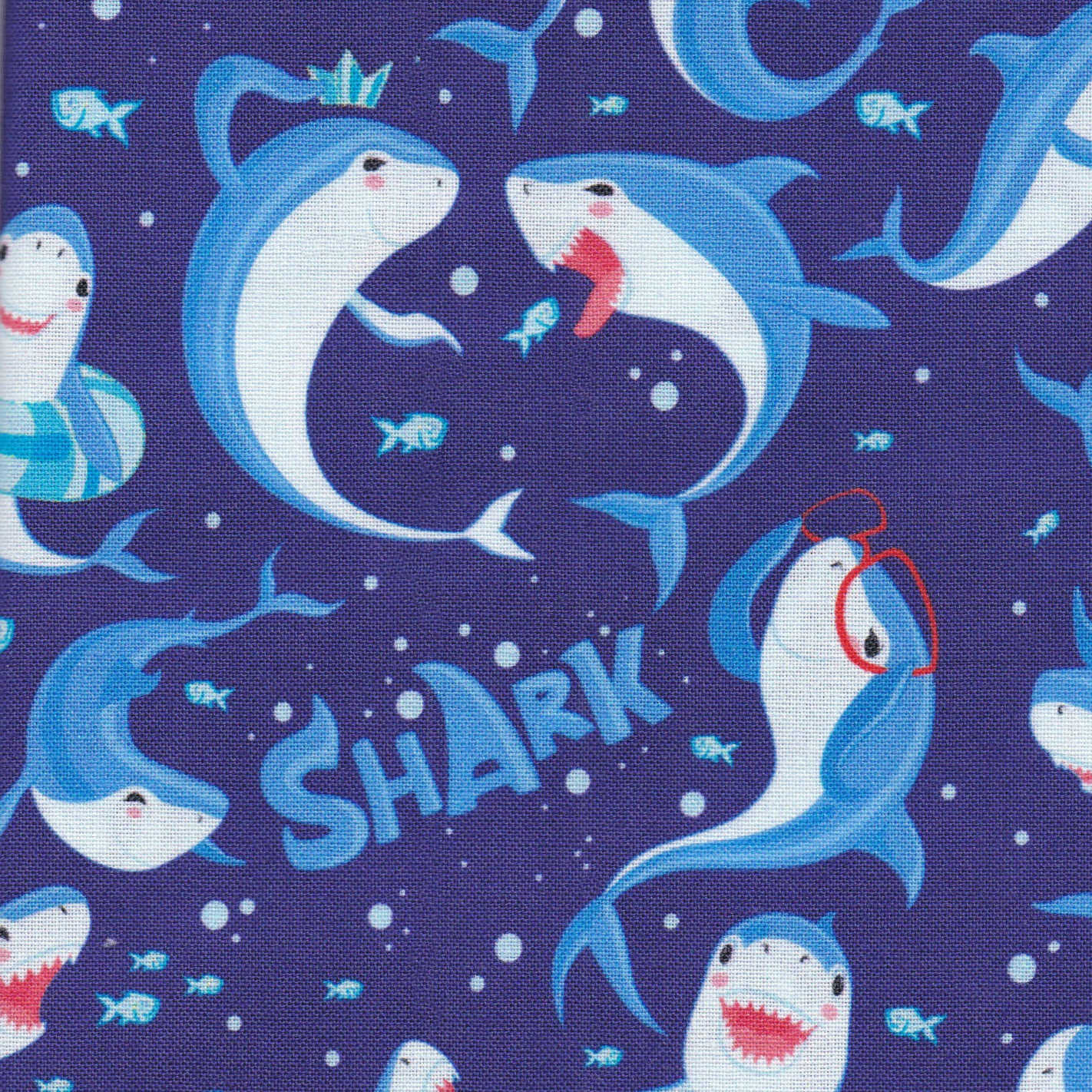 scrub cap with sharks, fish, and the word SHARK