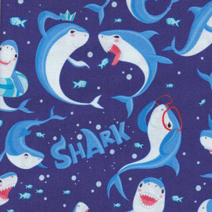 scrub cap with sharks, fish, and the word SHARK